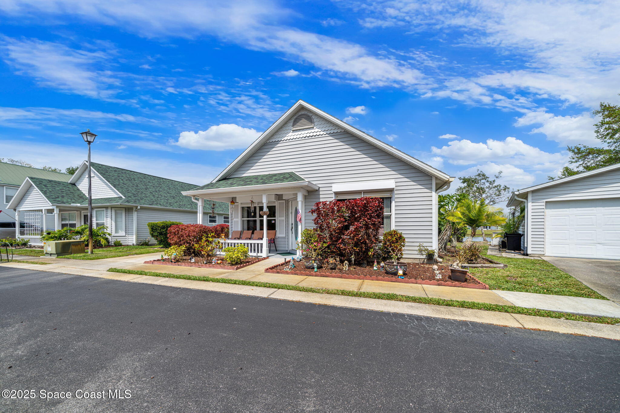 3847 Town Square Boulevard, Unit 30 Melbourne, FL 32901 - Photo 3 of 36 a view of a house with a patio