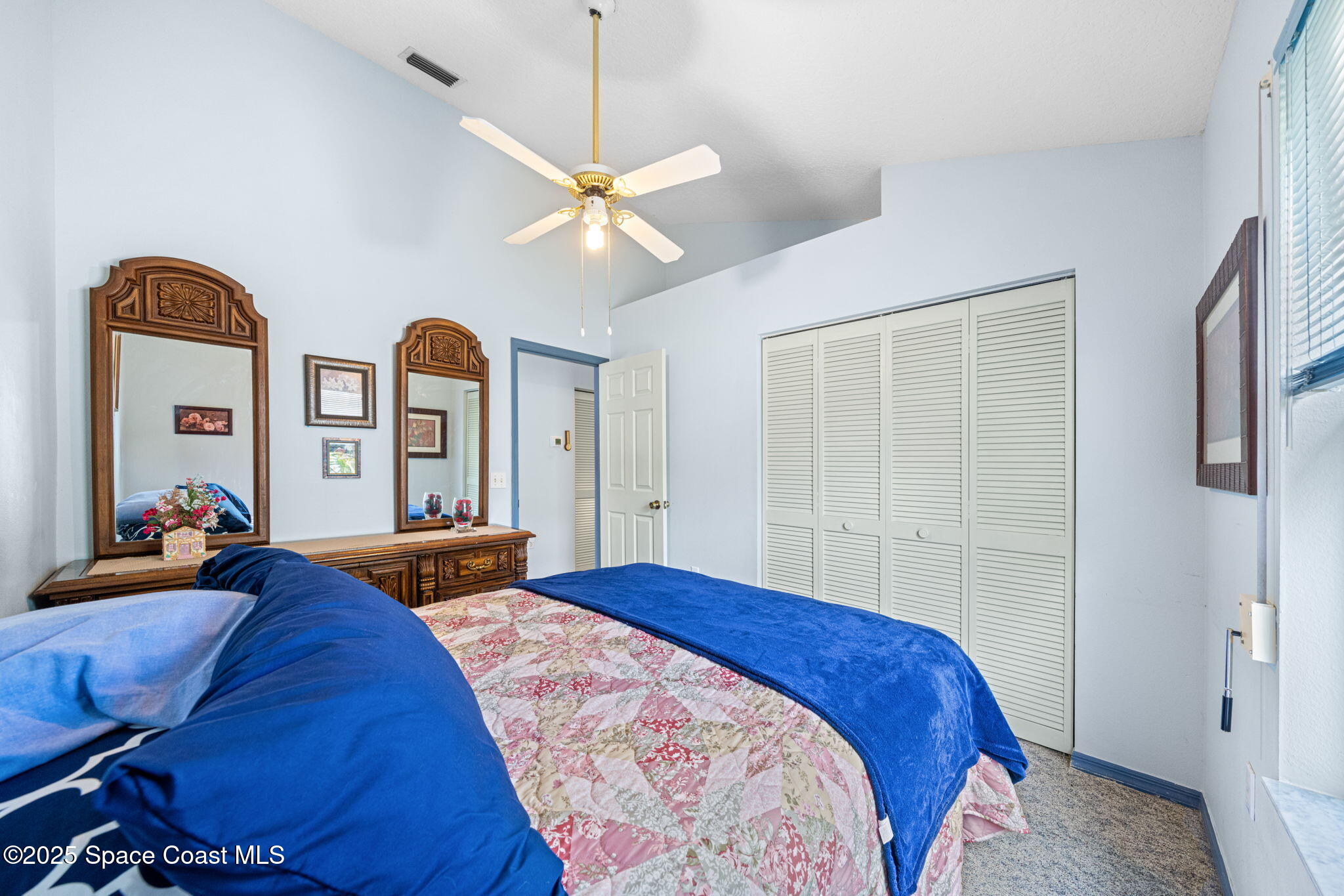 3847 Town Square Boulevard, Unit 30 Melbourne, FL 32901 - Photo 34 of 36 a bedroom with bed and window
