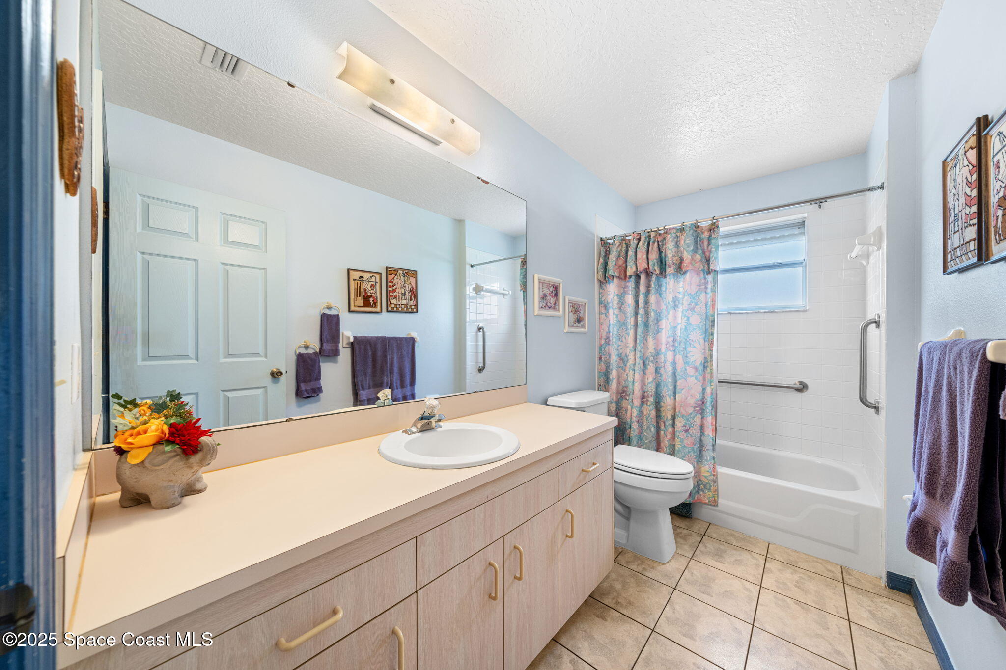 3847 Town Square Boulevard, Unit 30 Melbourne, FL 32901 - Photo 35 of 36 a bathroom with a sink toilet and shower