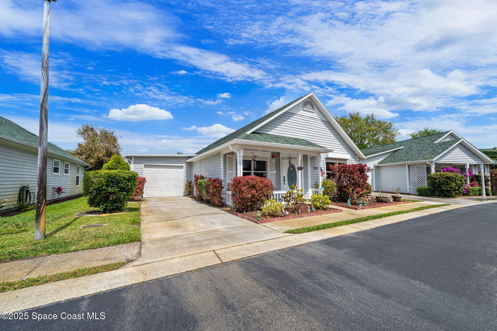 3847 Town Square Boulevard, Unit 30 Melbourne, FL 32901 - Photo 4 of 36 a front view of a house with a porch