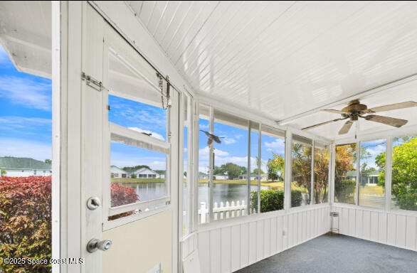 3847 Town Square Boulevard, Unit 30 Melbourne, FL 32901 - Photo 6 of 36 a view of a glass door with a yard from a corridor