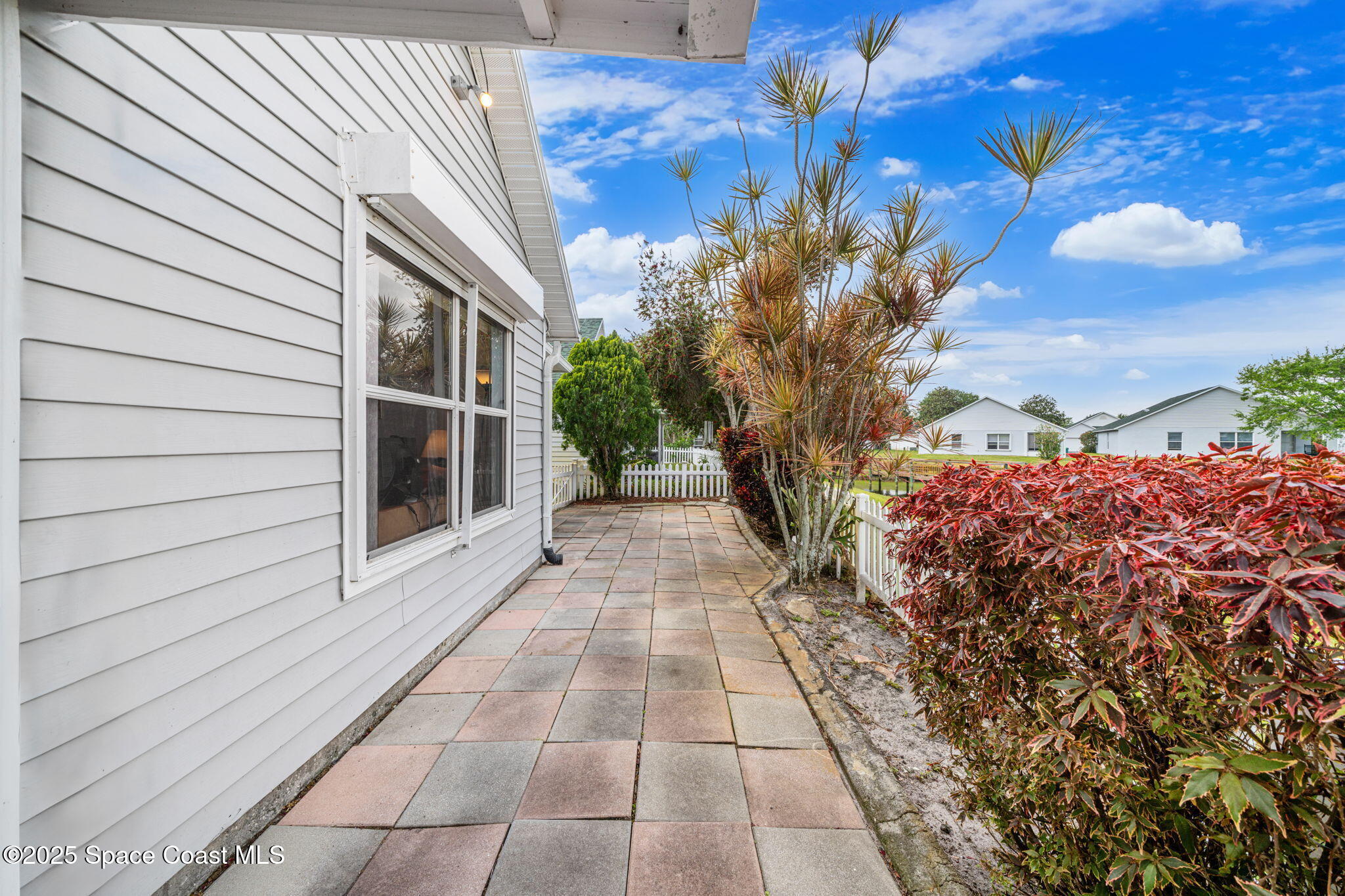 3847 Town Square Boulevard, Unit 30 Melbourne, FL 32901 - Photo 7 of 36 a view of a pathway with a house