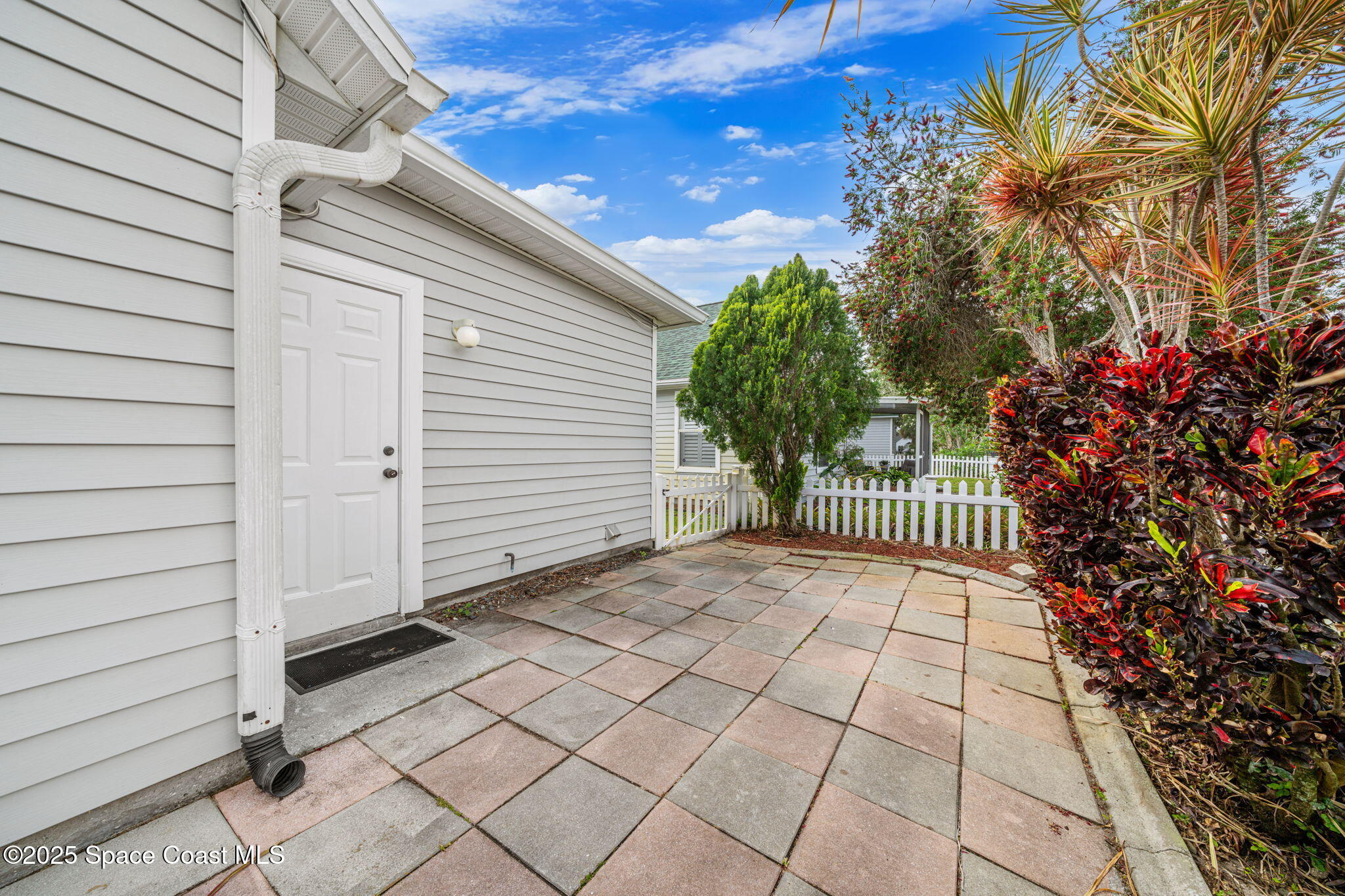 3847 Town Square Boulevard, Unit 30 Melbourne, FL 32901 - Photo 9 of 36 a view of backyard with pathway