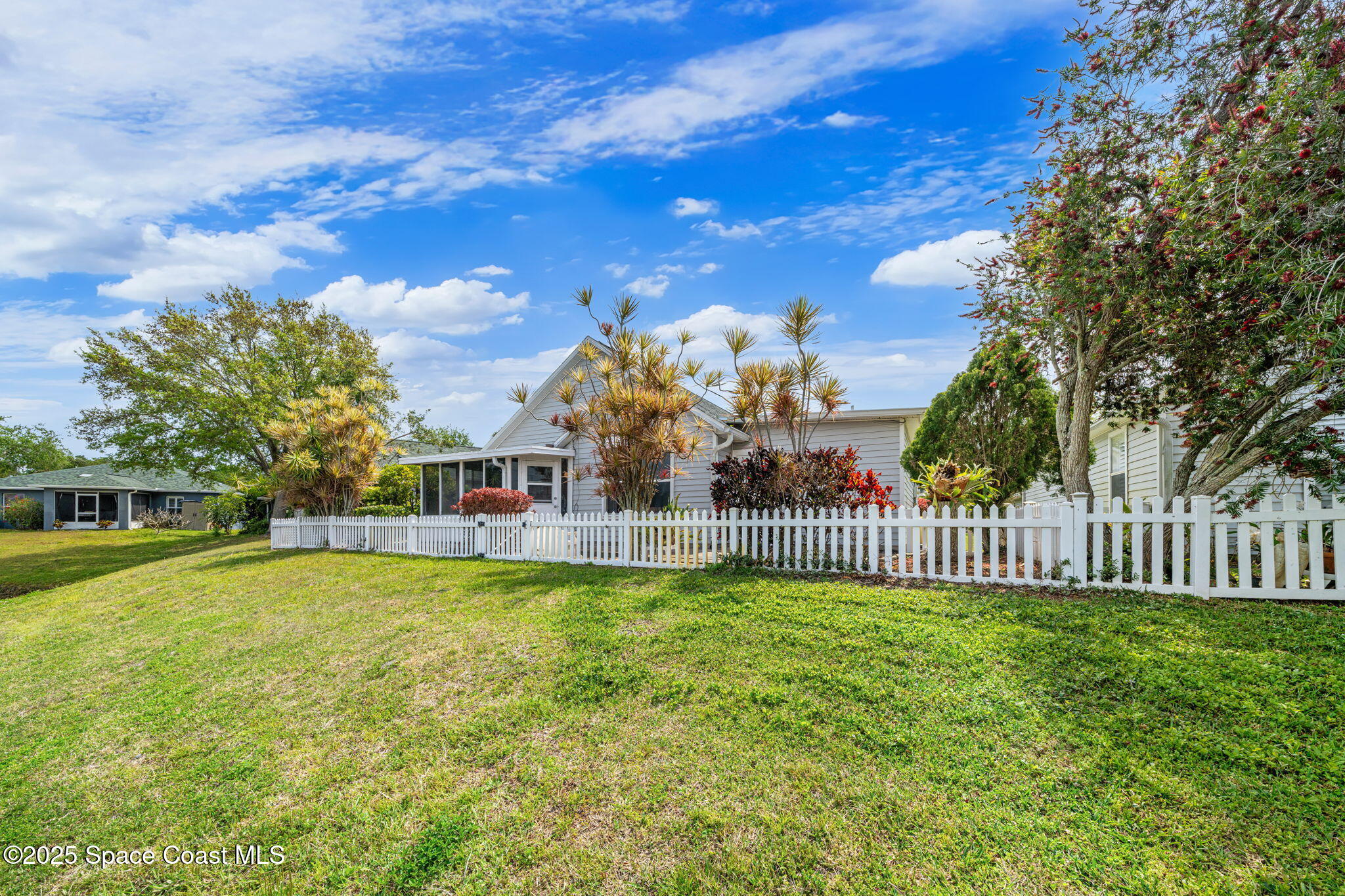 3847 Town Square Boulevard, Unit 30 Melbourne, FL 32901 - Photo 10 of 36 a view of a house with swimming pool and a yard