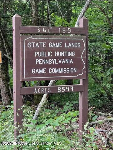 706 Pine Mill Road Equinunk, PA 18417 - Photo 14 of 14 a sign on the side of a building