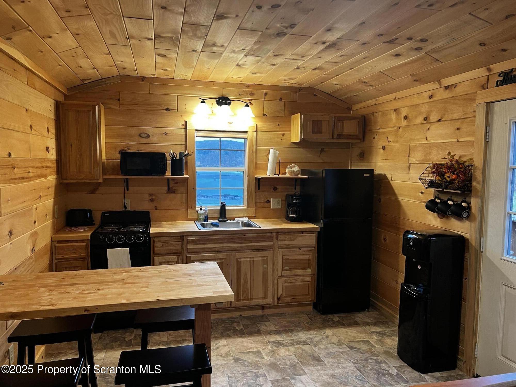 706 Pine Mill Road Equinunk, PA 18417 - Photo 6 of 14 a kitchen with cabinets and appliances