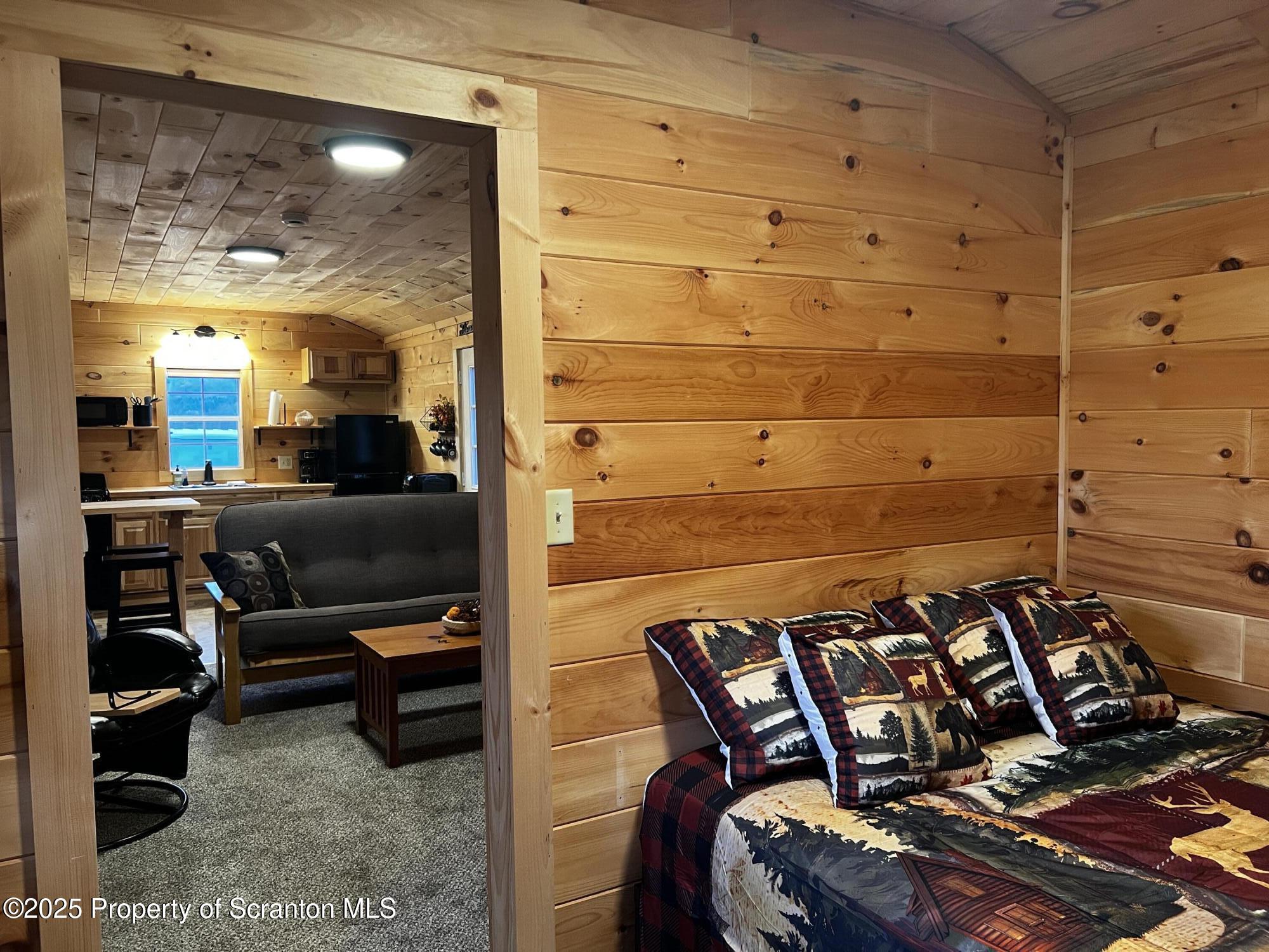 706 Pine Mill Road Equinunk, PA 18417 - Photo 7 of 14 a view of a balcony and a potted plant