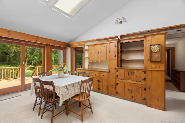 a view of a dining room with furniture window and outside view