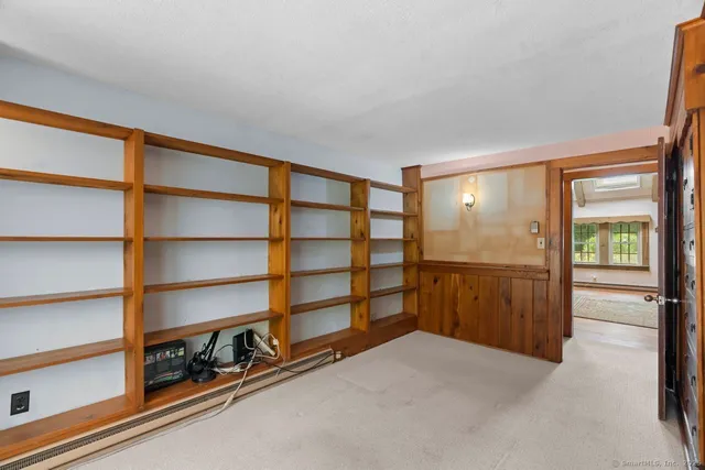 a view of an empty room with a closet