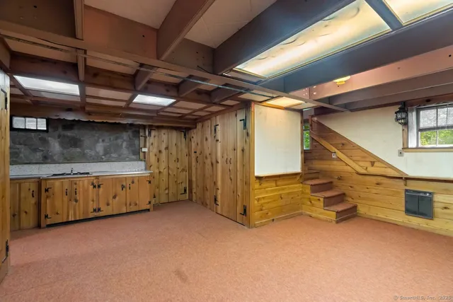 a view of an empty room with a fireplace