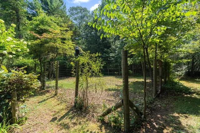 a view of balcony with wooden fence