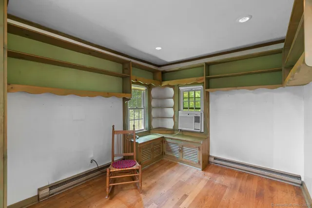 a room with furniture and a window