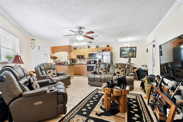 a living room with lots of furniture and a flat screen tv