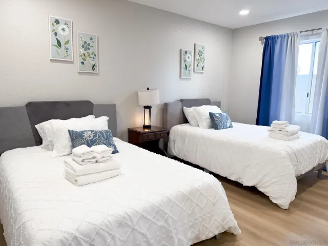 a view of a bedroom with a bed