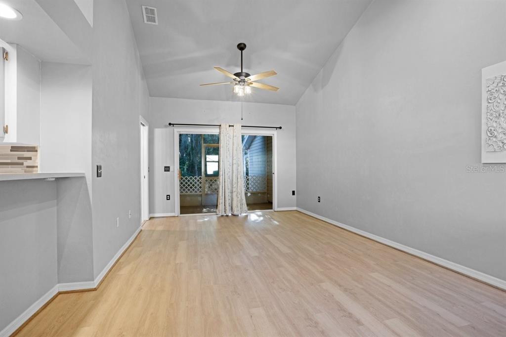 4700 Southwest Archer Road, Unit 23 Gainesville, FL 32608 - Photo 3 of 14 Dining Area and Livingroom facing the rear