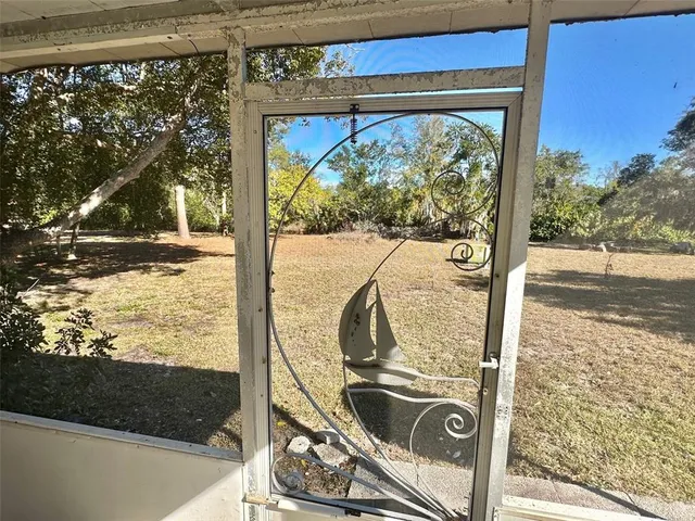 a view of living room with furniture and floor to ceiling window