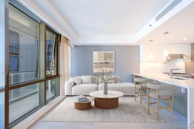 a dining room with furniture and a window