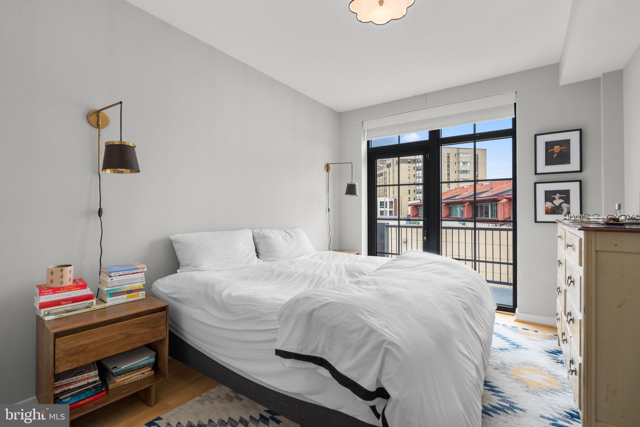 2412 17th Street Northwest, Unit 301 Washington, DC 20009 - Photo 12 of 18 a bedroom with a bed and a dresser