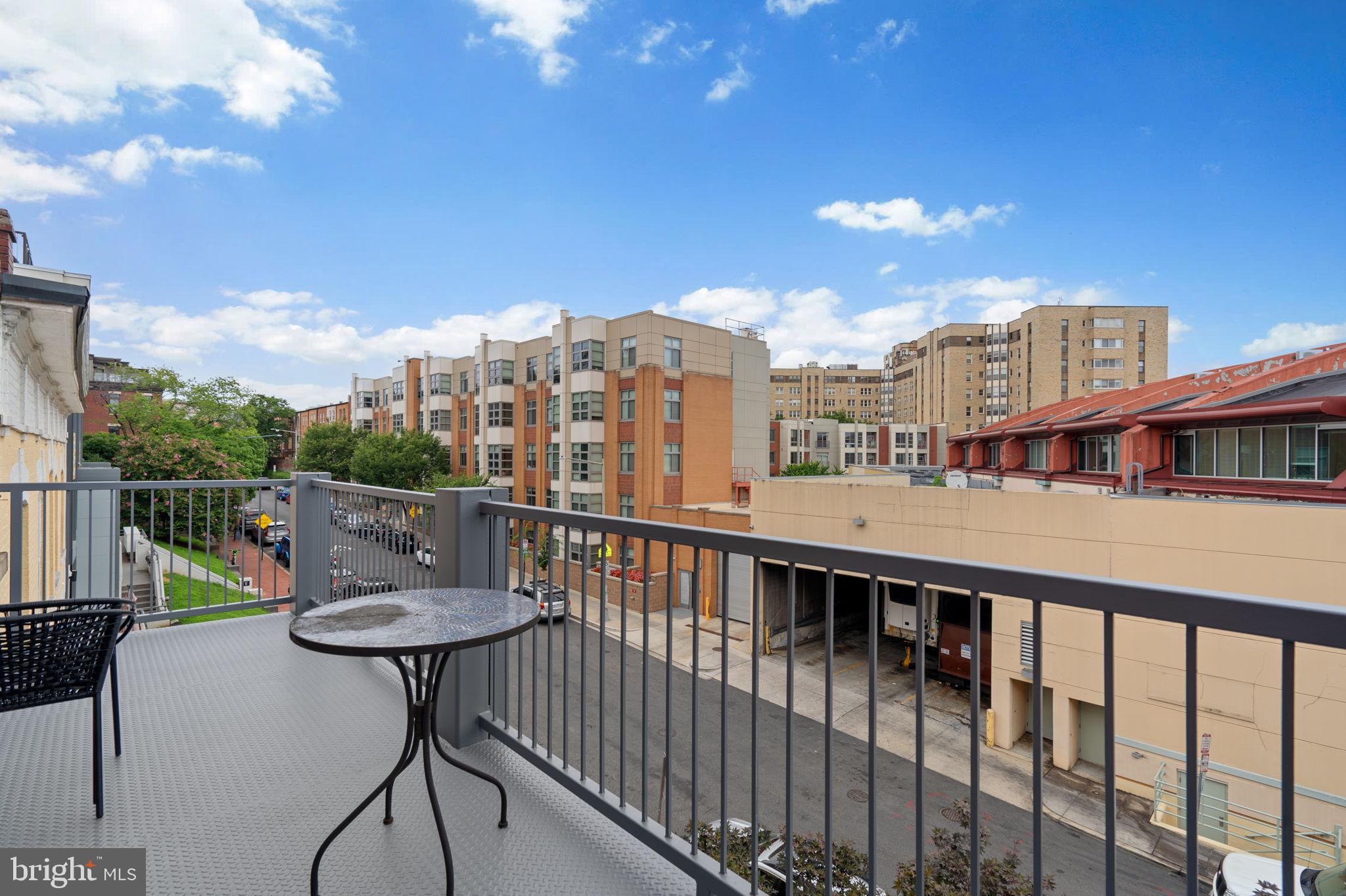 2412 17th Street Northwest, Unit 301 Washington, DC 20009 - Photo 17 of 18 a view of a balcony with two chairs and a table