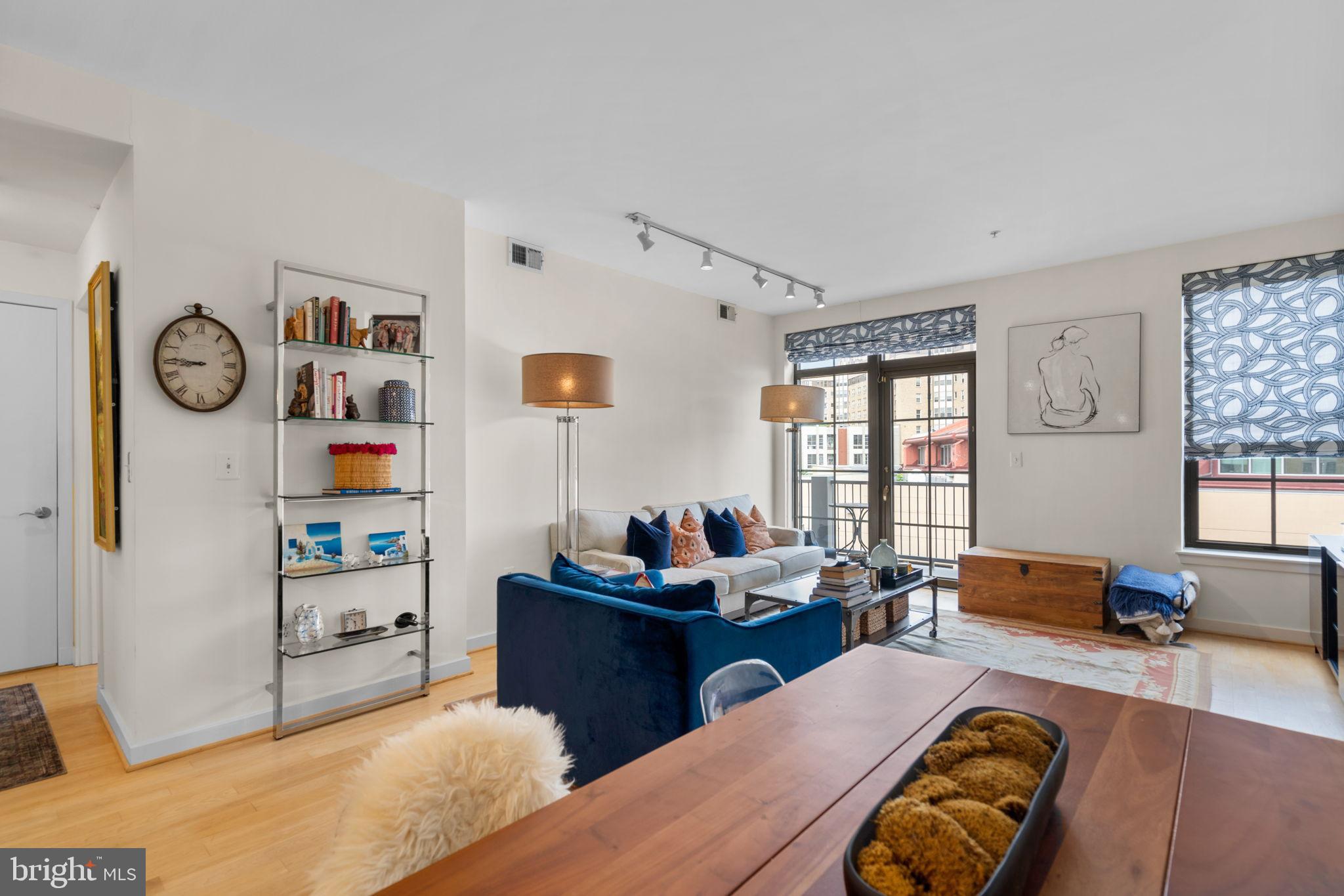 2412 17th Street Northwest, Unit 301 Washington, DC 20009 - Photo 8 of 18 a living room with furniture and a window