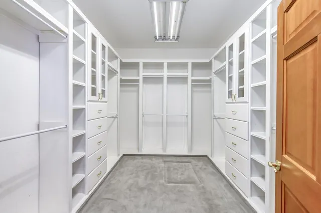 a utility room with sink dryer and washer