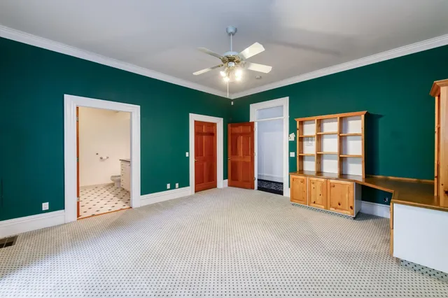a kitchen with granite countertop a sink stove and refrigerator