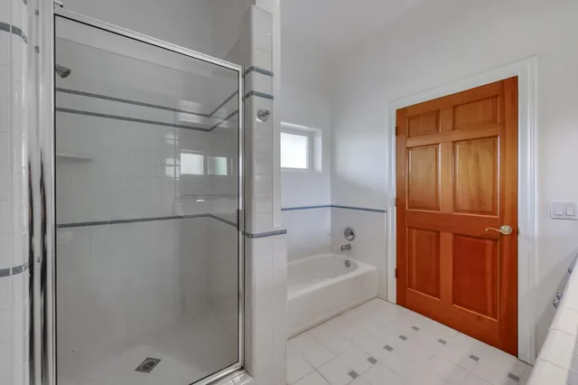 a large kitchen with a lot of counter space and a wooden floor