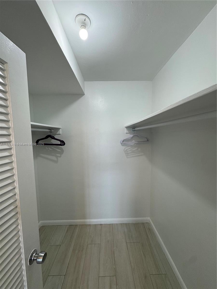 5161 Collins Avenue, Unit 1206 Miami Beach, FL 33140 - Photo 21 of 28 wooden floor in an empty room