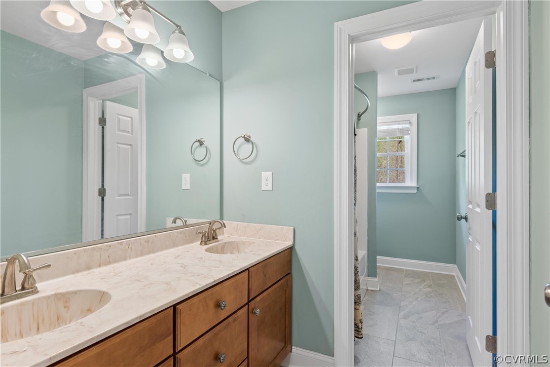 12660 Clarke Road Lanexa, VA 23089 - Photo 47 of 49 Hall bath with tile flooring, double sinks and sep