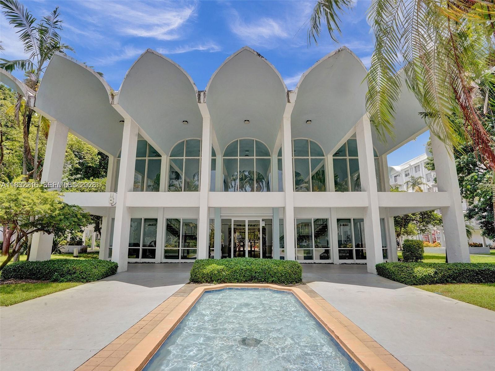 496 Northwest 165th Street, Unit D310 Miami, FL 33169 - Photo 15 of 16 front view of a building