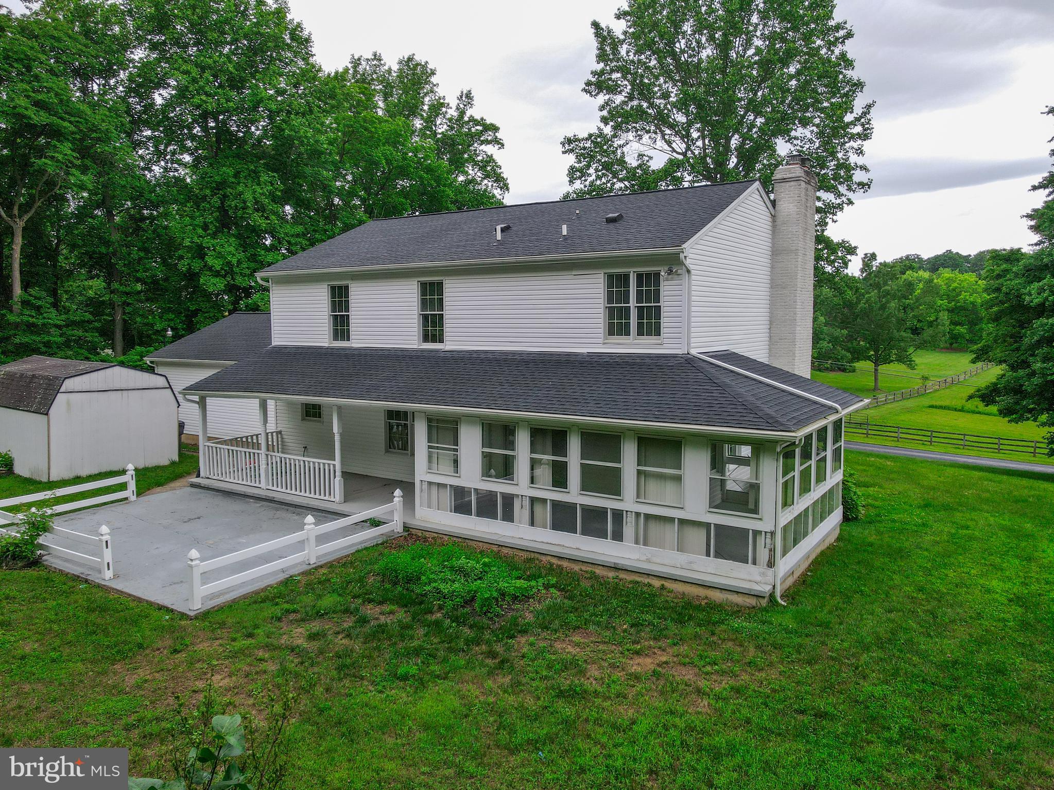 Enclosed sunroom and covered porch