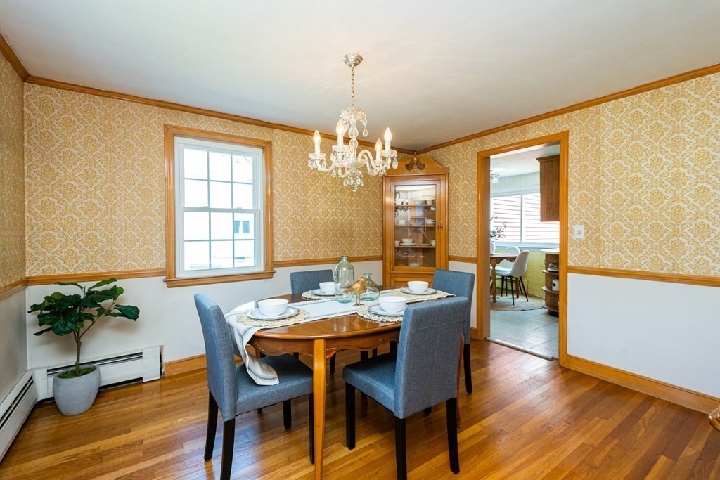 9 Linnea Lane Reading, MA 01867 - Photo 16 of 33 a view of a dining room with furniture window and wooden floor
