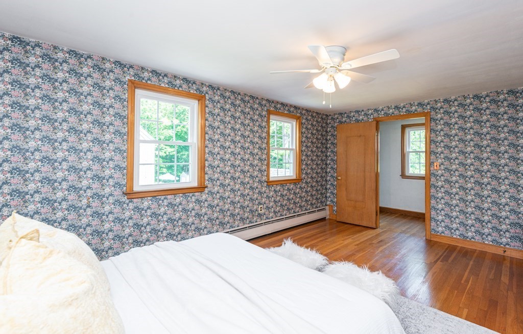 9 Linnea Lane Reading, MA 01867 - Photo 19 of 33 a bedroom with a bed and a window