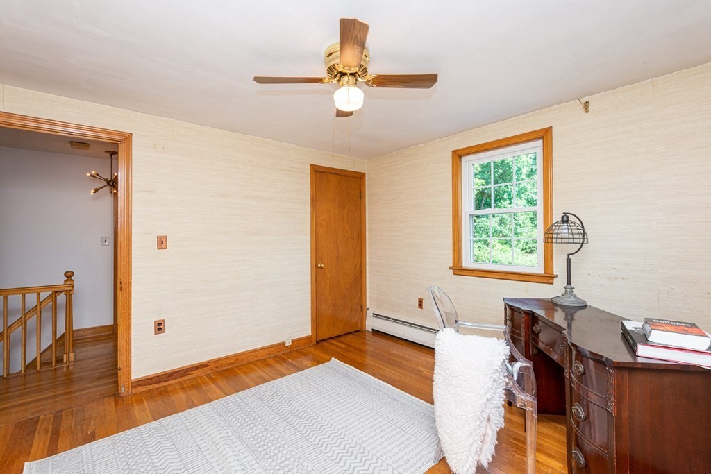 9 Linnea Lane Reading, MA 01867 - Photo 23 of 33 a bedroom with a bed and a window