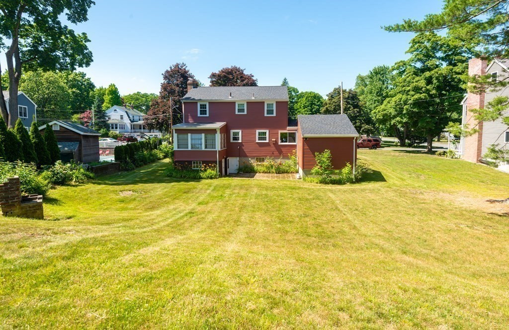 9 Linnea Lane Reading, MA 01867 - Photo 30 of 33 a view of a swimming pool with a house in the background