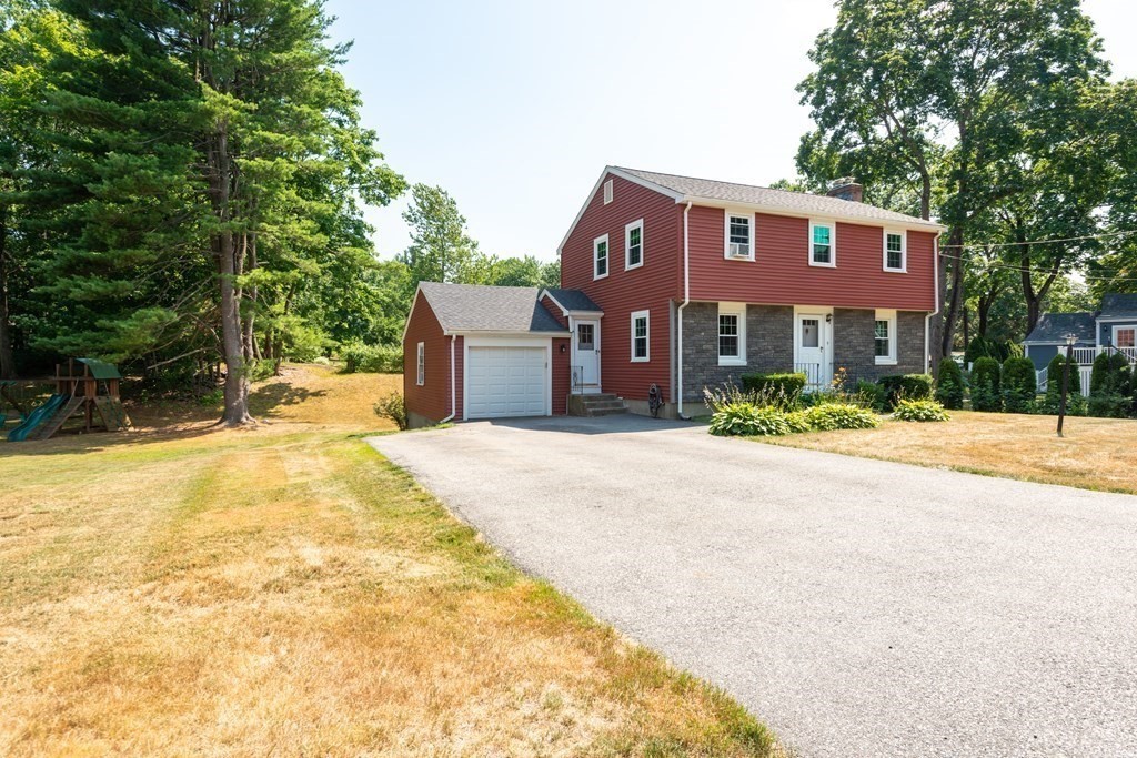 9 Linnea Lane Reading, MA 01867 - Photo 33 of 33 a front view of a house with a yard