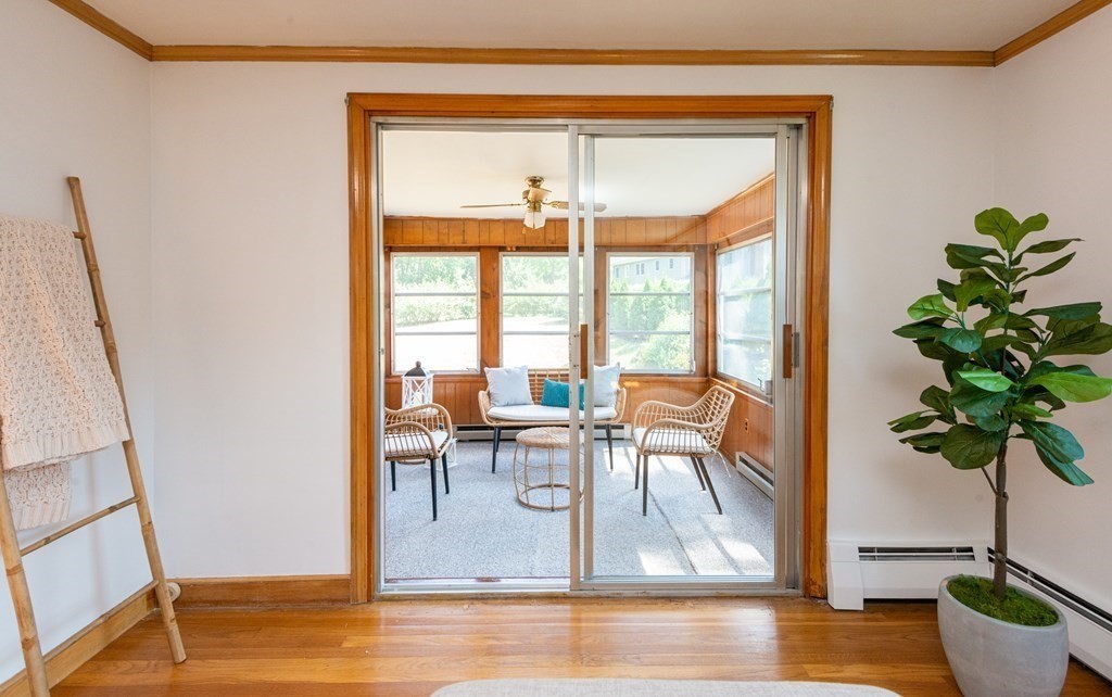 9 Linnea Lane Reading, MA 01867 - Photo 7 of 33 a view of a livingroom with furniture and a potted plant