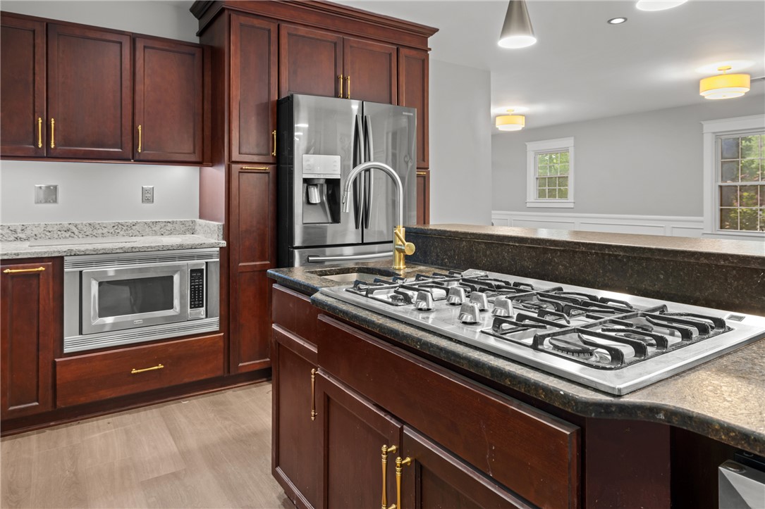 309 Woodland Way Clemson, SC 29631 - Photo 8 of 43 This thoughtfully designed kitchen boasts efficient appliances and ample cabinetry.
