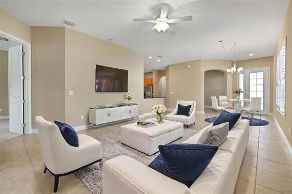 a living room with furniture and a flat screen tv