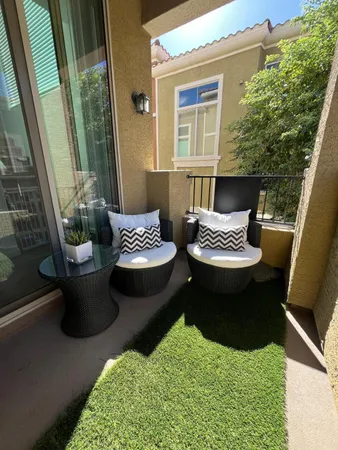 a view of backyard of house with seating space