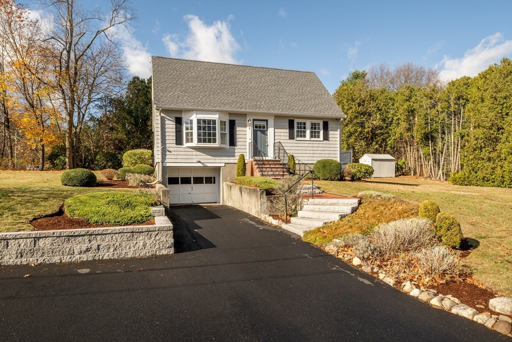 1 Roberts Road Billerica, MA 01821 - Photo 1 of 16 a front view of a house with a yard