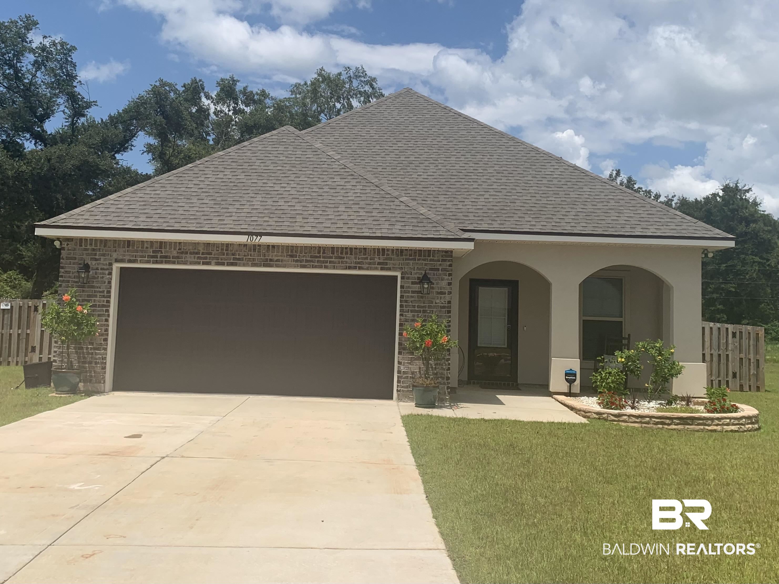 1077 Stella Road Foley, AL 36535 - Photo 1 of 27 View of front of house with brick siding, roof with shingles, and driveway