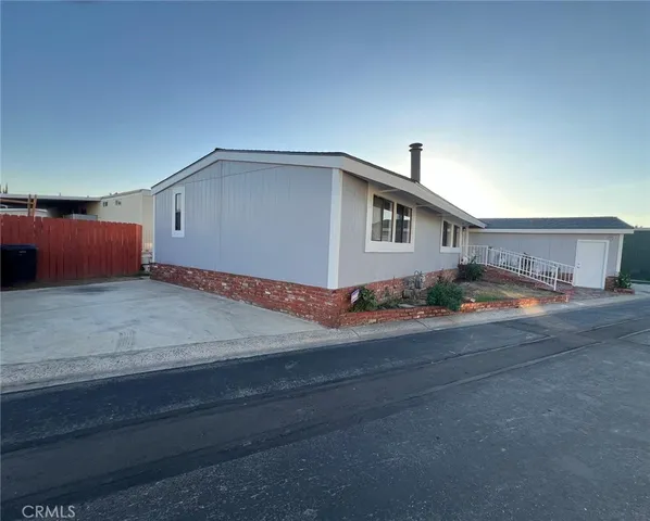 a house view with a backyard space