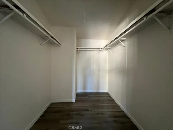 a view of an empty walk in closet