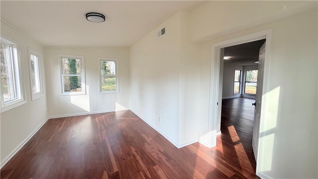 5257 Post Ridge Court Stone Mountain, GA 30088 - Photo 16 of 42 wooden floor in an empty room with a window