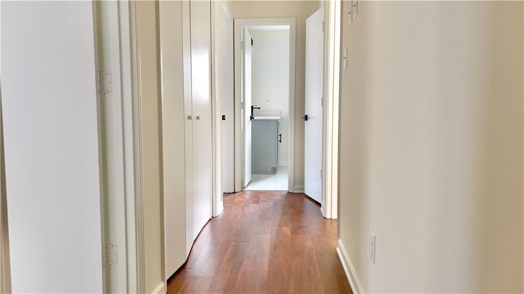 5257 Post Ridge Court Stone Mountain, GA 30088 - Photo 18 of 42 a view of a hallway with wooden floor