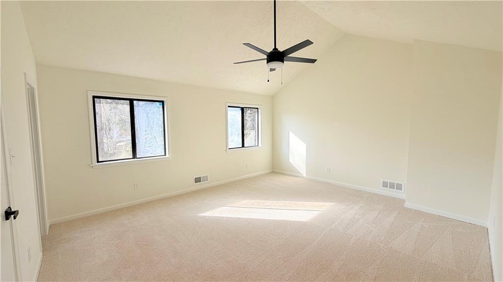 5257 Post Ridge Court Stone Mountain, GA 30088 - Photo 20 of 42 a view of empty room with windows