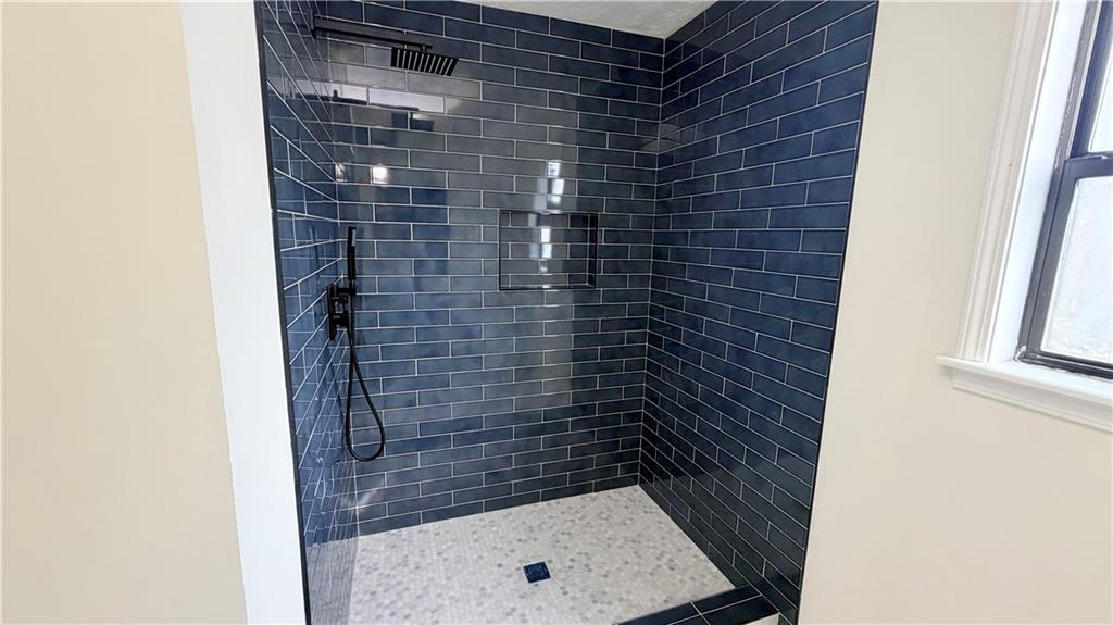 5257 Post Ridge Court Stone Mountain, GA 30088 - Photo 23 of 42 a bathroom with a shower