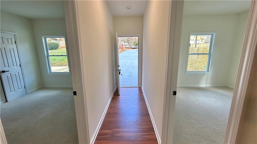 5257 Post Ridge Court Stone Mountain, GA 30088 - Photo 33 of 42 a view of a hallway with wooden floor and closet