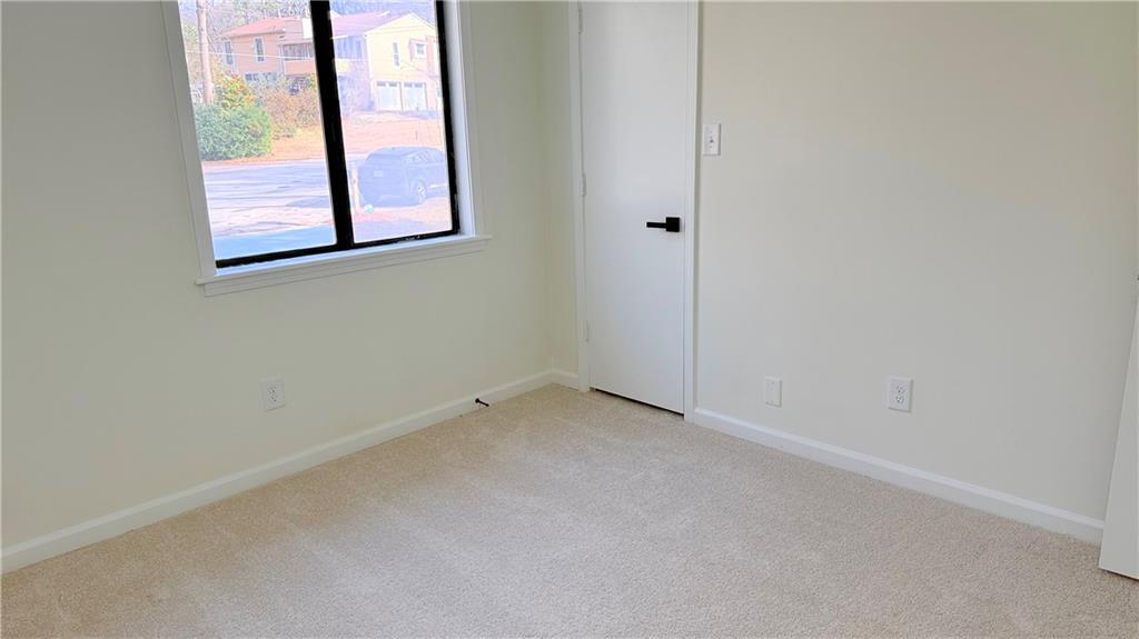 5257 Post Ridge Court Stone Mountain, GA 30088 - Photo 39 of 42 an empty room with a window